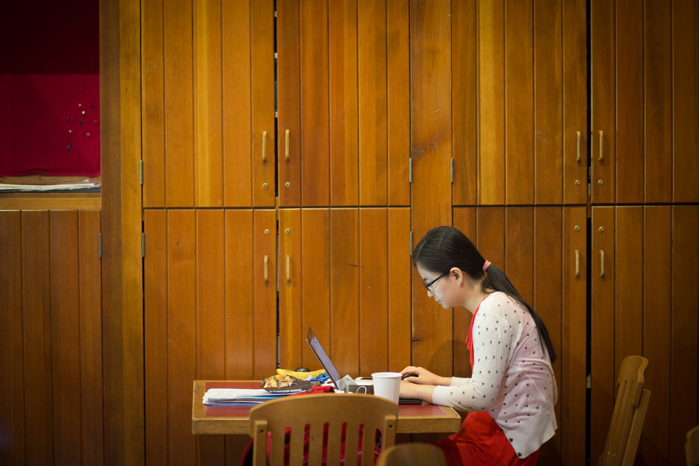 Student typing on a laptop