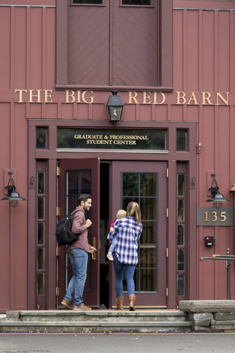 Student family entering Big Red Barn