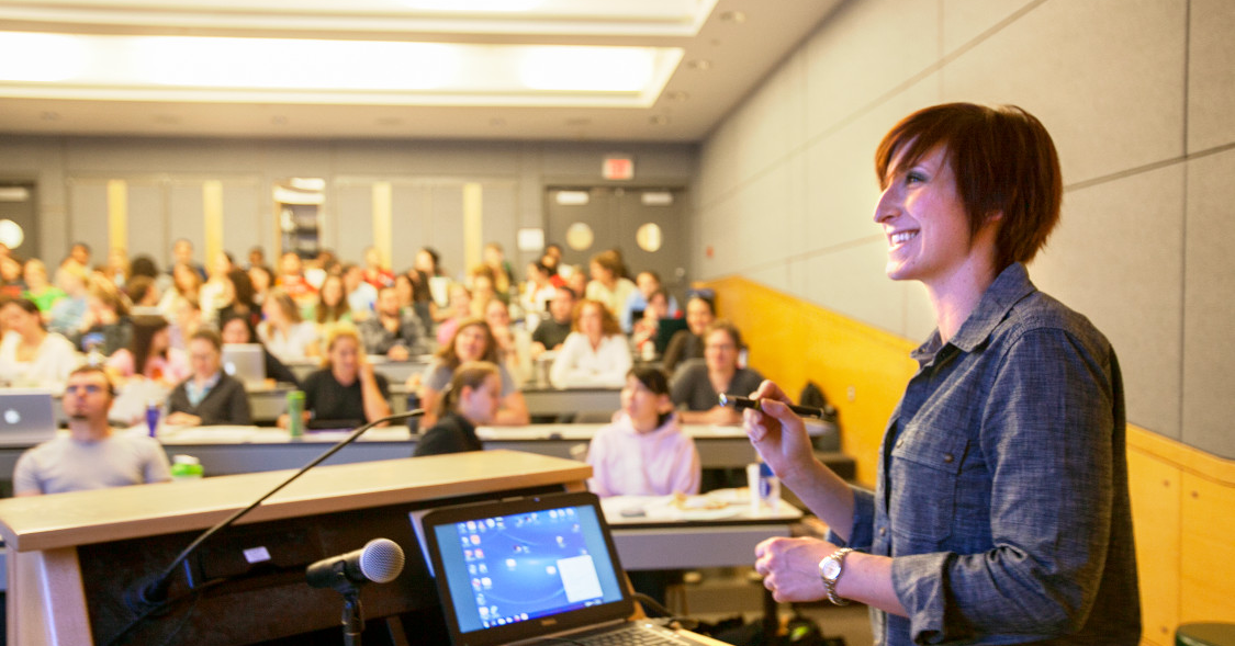 Teaching assistant in front of class