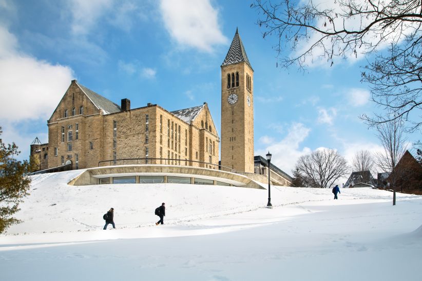 Students walk across campus in snow