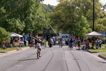 Street filled with bicyclists and pedestrians