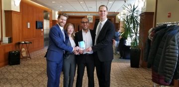 Four MILR students who won the case competition