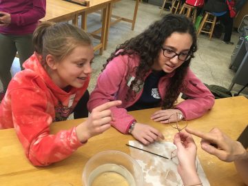 Two students participating in a workshop on bubbles