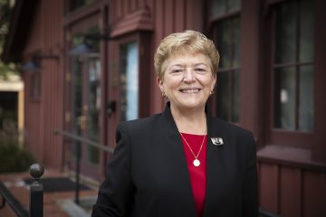 Kathryn Boor, dean of the Graduate School and vice provost for graduate education, in front of the Big Red Barn Graduate and Professional Student Center