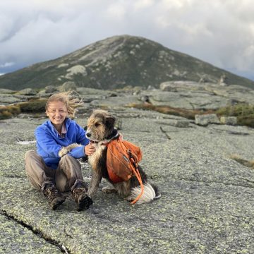 Kara Fikrig and dog on mountain