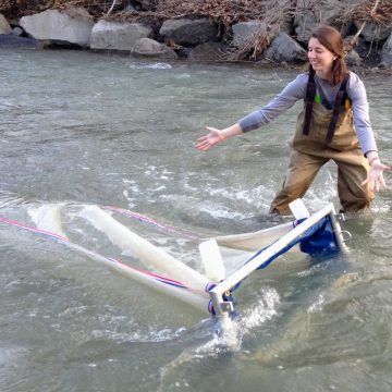 Lisa Watkins showcasing a net in the water