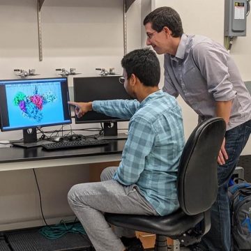 Doctoral student Saket Bagde and Professor Chris Fromme in lab