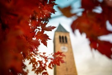 McGraw Tower framed by autumn leaves