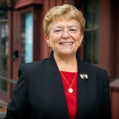 Dean of the Graduate School and Vice Provost for Graduate Education Kathryn J. Boor stands in front of the Big Red Barn Graduate and Professional Student Center