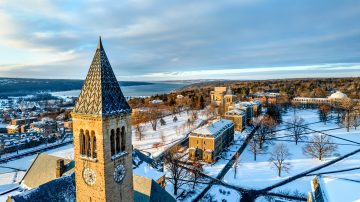 Aerial view of Cornell's campus after snowfall with McGraw Tower in the foreground