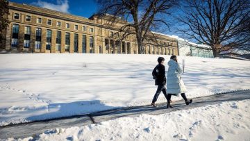 Students walk down Feeney Way