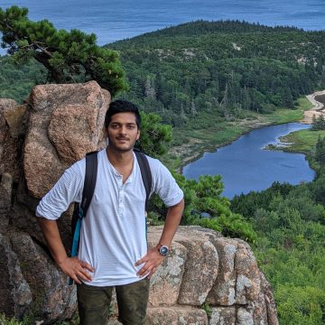 Vaibhav Sharma on a mountain above a sea