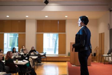 Eliza VanCort addresses graduate and professional students, postdocs, faculty, and staff attending a 2019 Pathways to Success Symposium.