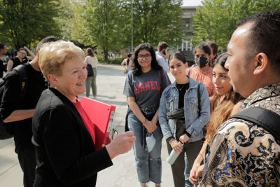 Dean Kathryn Boor with students on Bailey Plaza