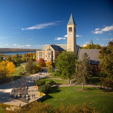 McGraw Tower, Uris Library, Ho Plaza, and Cayuga Lake in fall.