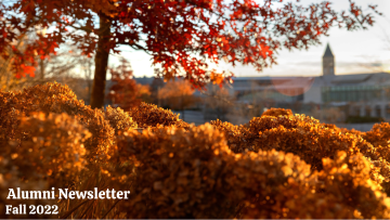 McGraw Tower seen from the Physical Sciences building in fall. Text overlay reading, 'Alumni Newsletter Fall 2022'