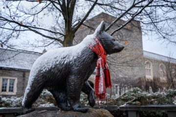 A light layer of snow covers the Touchdown statue