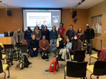 MAC Mentoring Program participants in front of a PowerPoint slide with a title on working with mentors