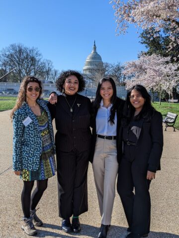 Three Cornell and one Weill Cornell doctoral candidates stand in front of the Capitol building