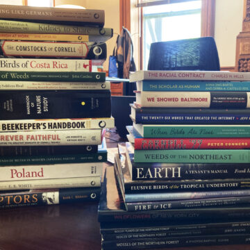 Stacks of books from CU Press.