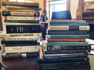 Stacks of books from CU Press.