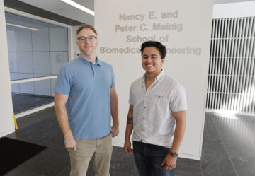 Jonathan Butcher and Alexander Cruz in the Nancy E. and Peter C. Meinig School of Biomedical Engineering building