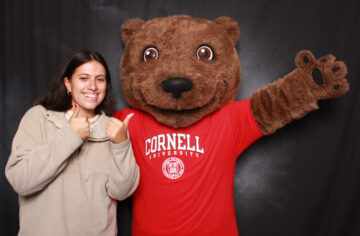 2023 Consider Cornell Experience participant positng with Touchdown