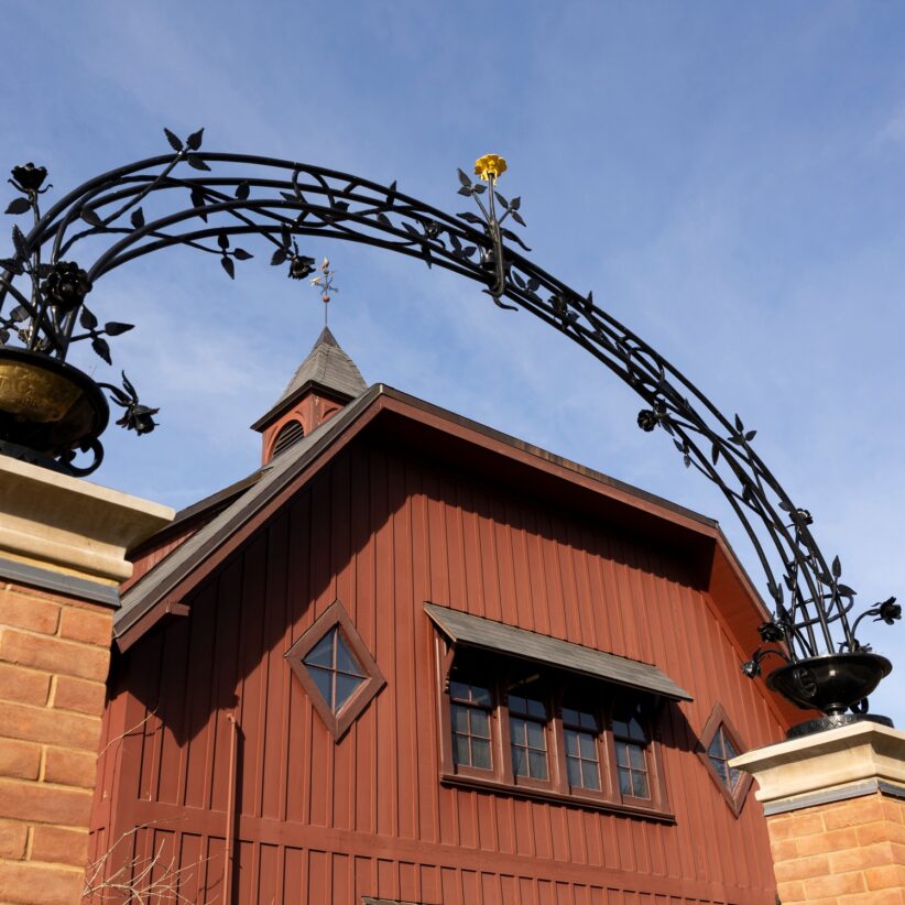 A decorative arch frames the Big Red Barn Graduate and Professional Student Center