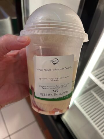 Mango yogurt parfait with granola with 7 dollar price on label visible