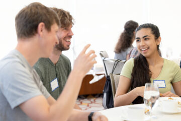 Students chat at a NextGen Professors Program luncheon