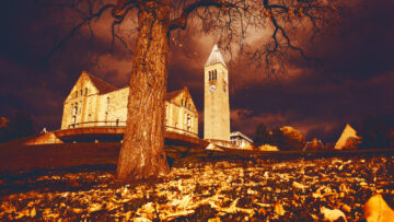 A stormy sky over Libe Slope, Uris Library and McGraw Tower in fall.