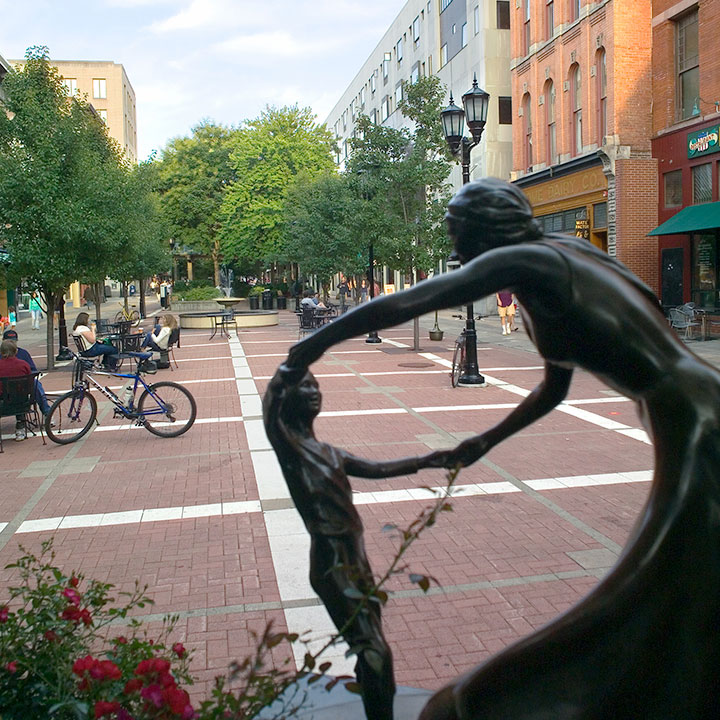 A bronze sculpture called “Song of Innocence” by Christi Harrington, displayed on the Commons Center Pavilion