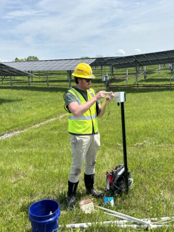 Tim Boycott services a passive acoustic monitoring unit.