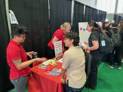 Members of the Graduate School Career and Professional Development team speak with students at the Grad Connect resource fair