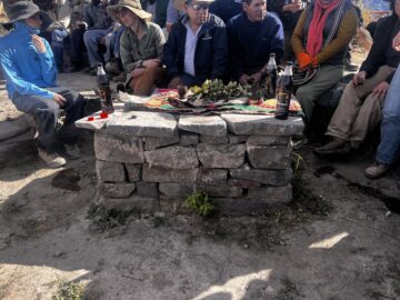 A stone table with offerings on top