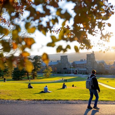 Students enjoy an autumn sunset from Libe Slope.