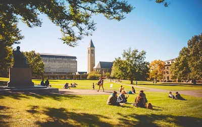 Students sit on the Arts Quad on a sunny fall day