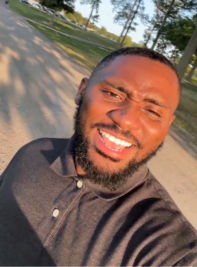 Amir Douglas takes a selfie while walking outside