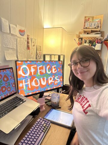 Jordan Deskins sits at open computers