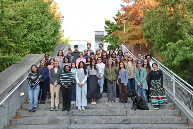 Dean's Scholars at the 2025 Pinning Ceremony, standing outside the Biotechnology building on the steps.