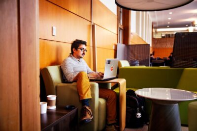 A graduate student sits in a quiet corner of Mann Library.