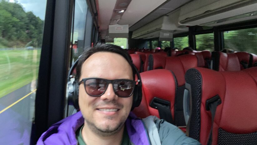 Sebastian Restrepo sits on a mostly empty bus